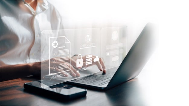 Woman typing on a laptop screen with a transparent screen projecting out of it