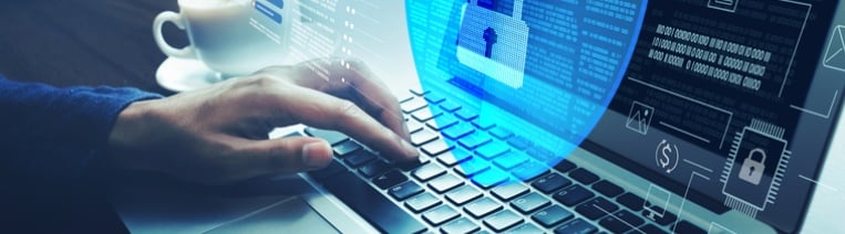 Person typing on a laptop with a transparent digital shield and lock icon overlay, representing cybersecurity, data protection, and secure online access.