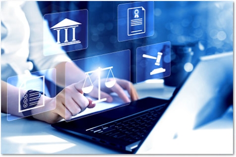 hands on a laptop with floating legal symbols on tiles in front of the screen