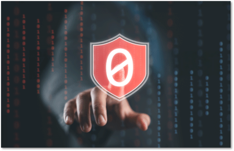 Finger pointing at a white zero in the middle of a red shield